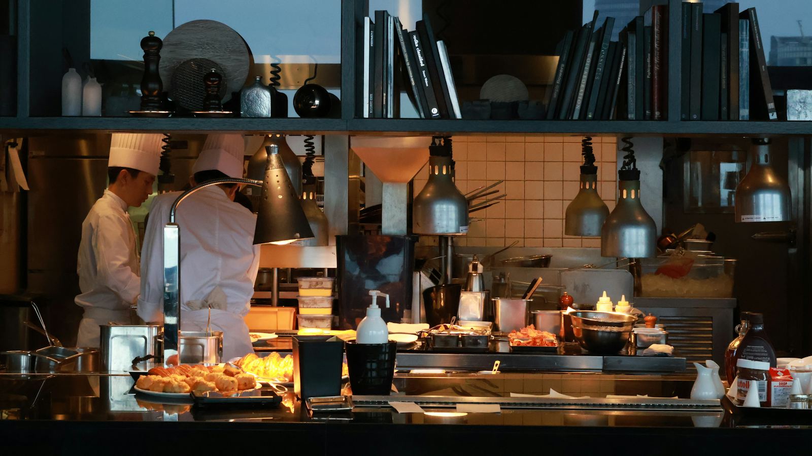 Chefs working in a busy commercial kitchen